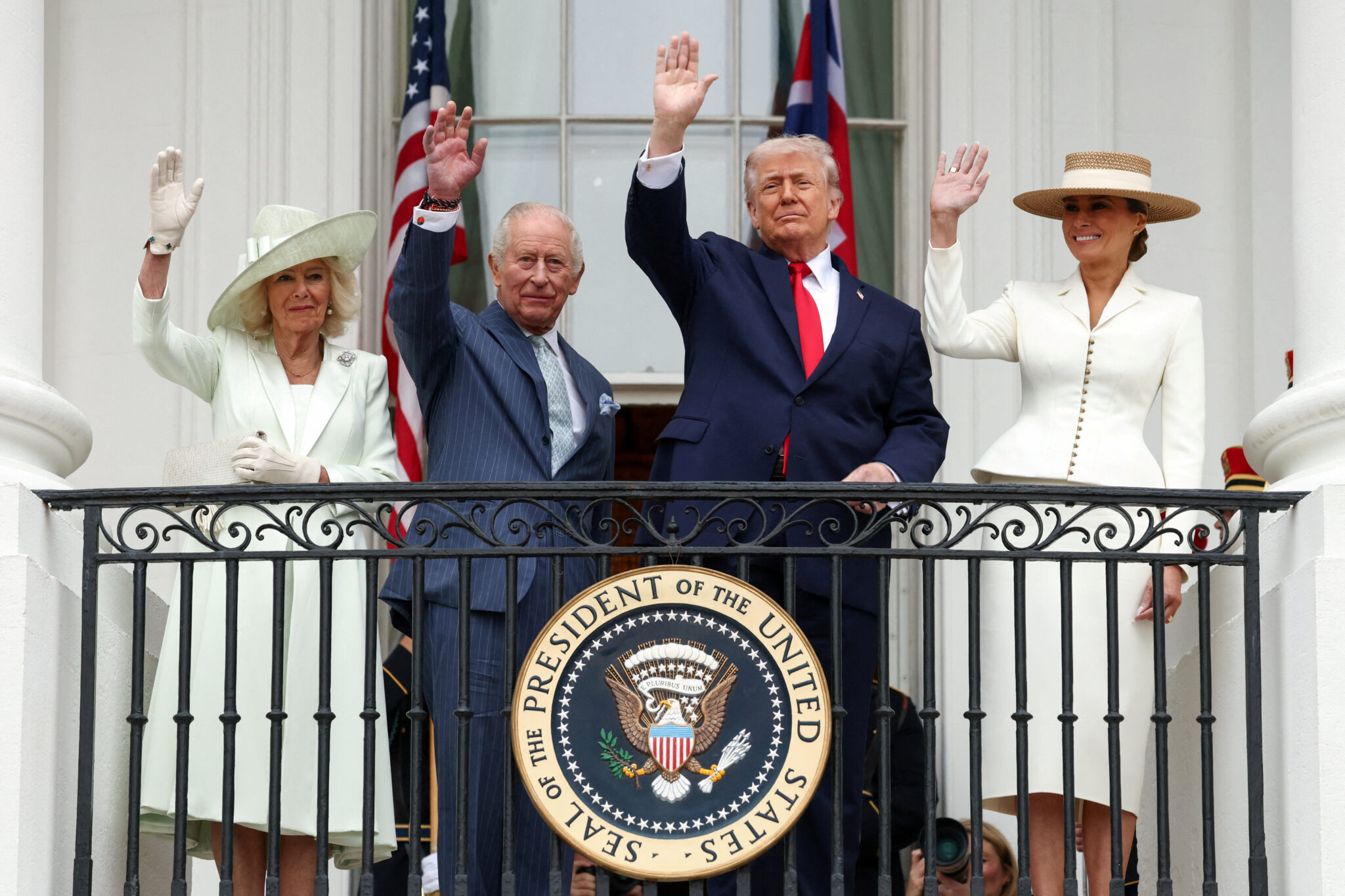 FILE PHOTO: U.S. President Donald Trump, Britain's King Charles, Queen Camilla and U.S. first lady Melania Trump wave from a balcony during an arrival ceremony for the king and queen on the South Lawn of the White House, in Washington, D.C., U.S., April 28, 2026. REUTERS/Kevin Lamarque/File Photo