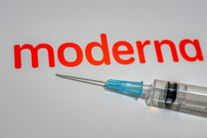 Sign,For,The,Biotechnology,Company,Moderna,With,A,Syringe,For