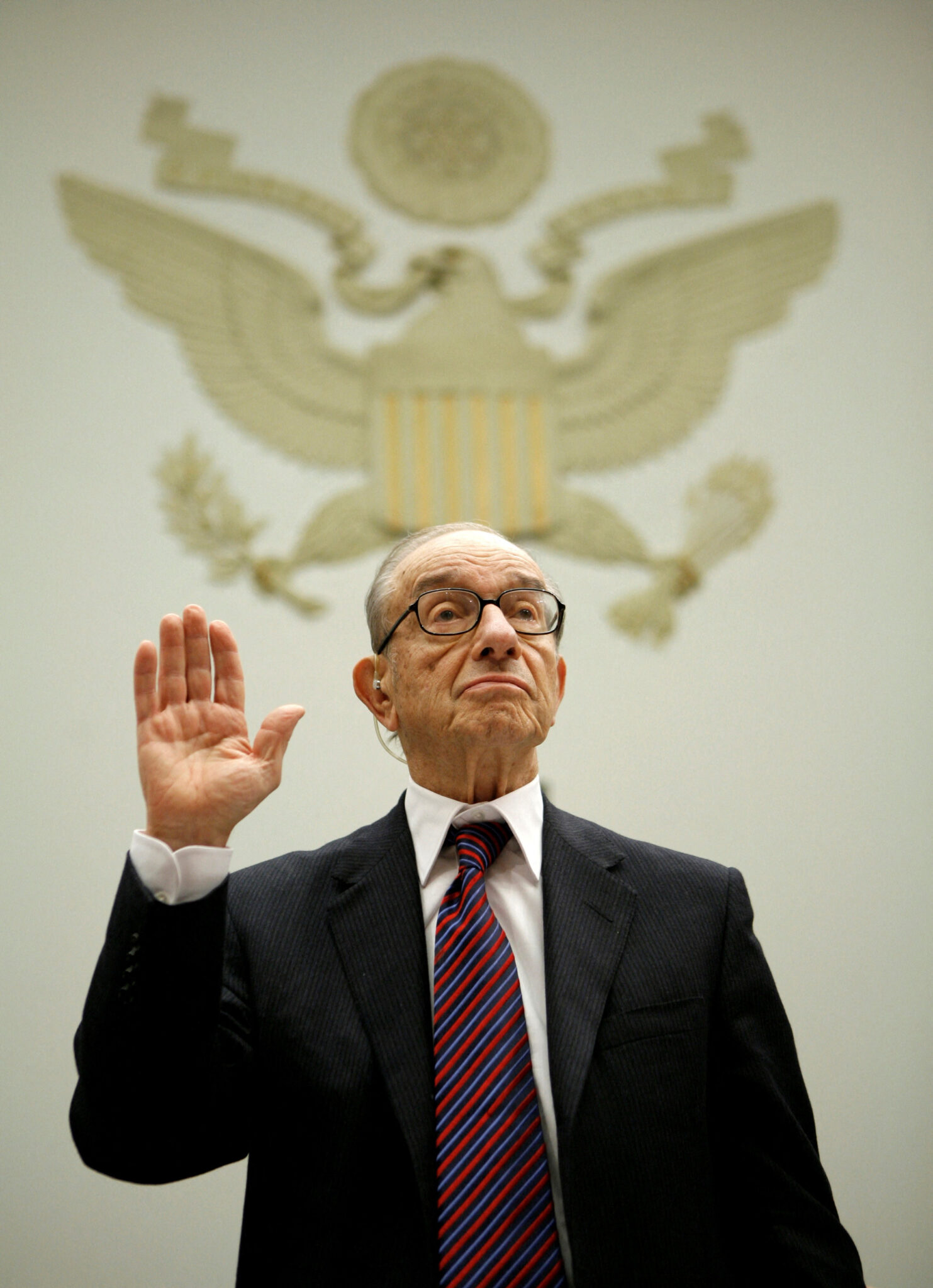 FILE PHOTO: Former U.S. Federal Reserve Chairman Alan Greenspan is sworn in to testify before the House Oversight and Government Reform Committee on Capitol Hill in Washington October 23, 2008. Greenspan told Congress on Thursday he is "shocked" at the breakdown in U.S. credit markets and that he sees more layoffs and a jump in unemployment ahead. REUTERS/Kevin Lamarque (UNITED STATES)/File Photo