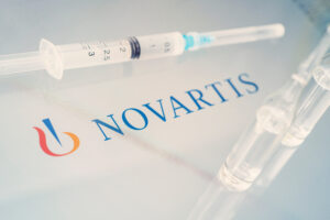 Vials,Of,Liquid,On,A,White,Table,And,The,Logo